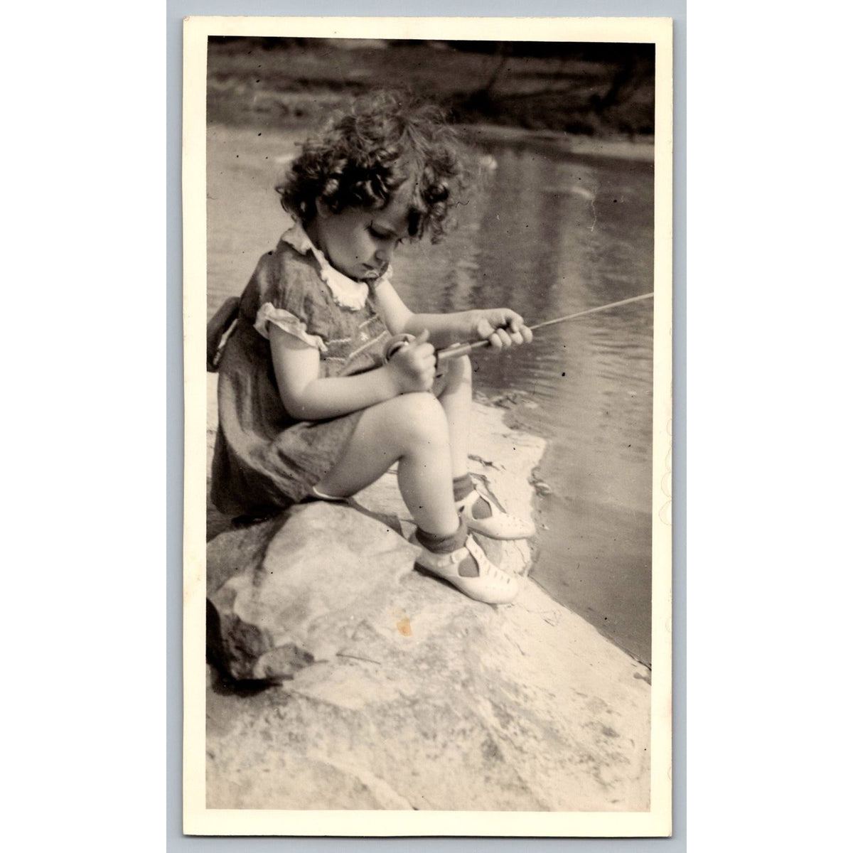 Child Girl Preschooler Fishing 1950s Snapshot Photograph Outdoors Candid Vintage